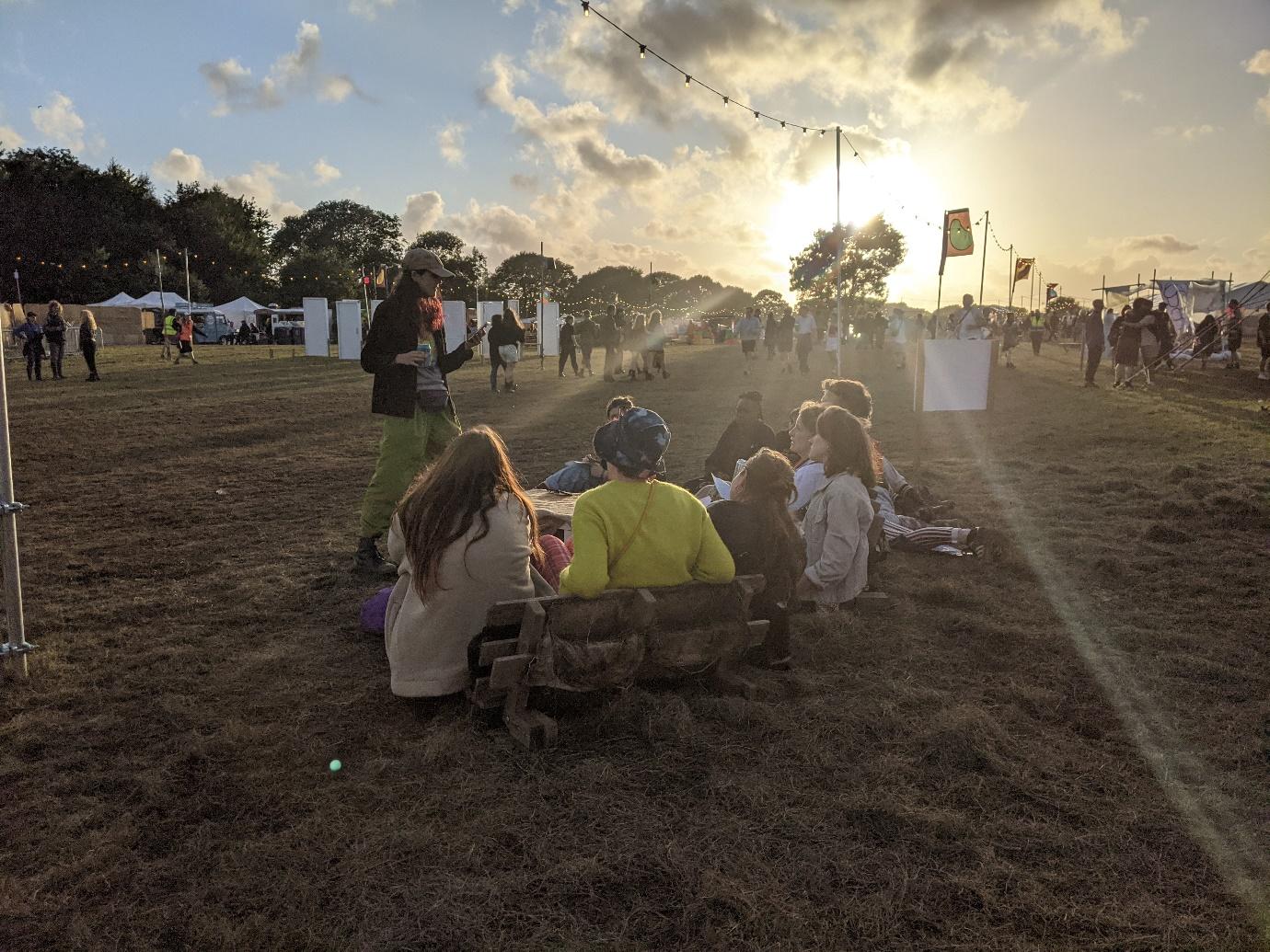 A picture containing grass, sky, outdoor, people
Description automatically generated